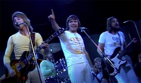 Music Friday Flashback: Tony Burrows Asks His ‘Beach Baby’ to Wear His Ring