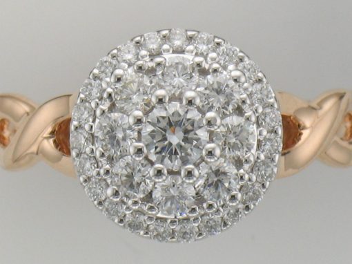 Round diamond cluster ring with .70ct GH SI2 diamonds set into the center of 14k white gold and braided style 14k rose gold band