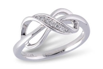 Infinity ring with round accenting diamonds totaling .07ct through the center, H/I Color, I 1 clarity, 14k white gold