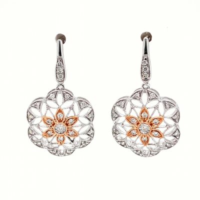 Open Filigree snowflake milgrain drop earrings with round accenting diamonds totaling .25ct, 14k white gold with 14k rose gold center, dangle off posts