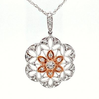 Open Filigree snowflake milgrain pendant with round accenting diamonds totaling .26ct, 14k white gold with 14k rose gold center, 18 inch light rope 14k white gold chain with spring ring clasp