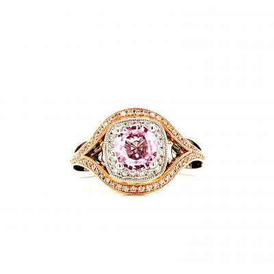 2 tone ring with 1.36ct Pink sapphire in the center and round accenting diamonds surrounding the sapphire and down the split band, 14k white and rose gold, all diamonds GH SI2 totaling .33ct