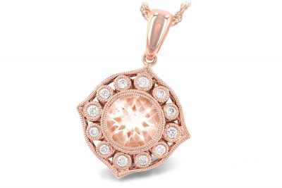 Vintage style pendant with bezel set round .98ct morganite with milgrain edging and round accenting diamonds set into round milgrain bezels surrounding center, all diamonds totaling .15ct, G Color ,SI1/SI2 clarity, 14k rose gold 18 inches