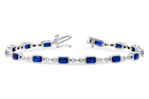 Sapphire and Diamond bracelet with 14 oval sapphires set into rectangular bezel set links and infinity link between each with 2 GH SI1 diamonds per infinity, all milgrain edging, 14k white gold, diamonds totaling .32ct, sapphires totaling 4ct