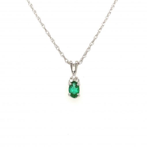 5x3mm Oval Emerald pendant with three round accenting diamonds totaling .025ct set above in all 14k white gold