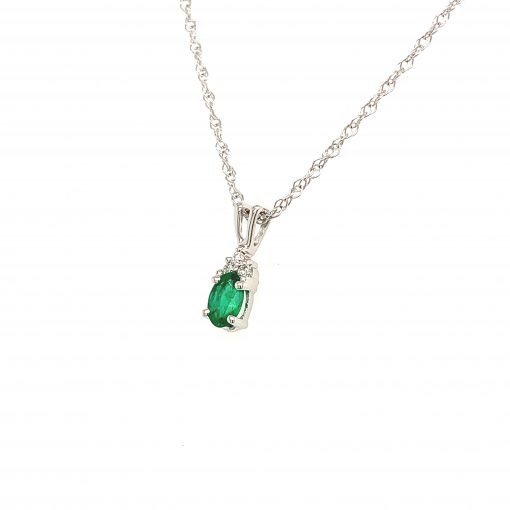 5x3mm Oval Emerald pendant with three round accenting diamonds totaling .025ct set above in all 14k white gold