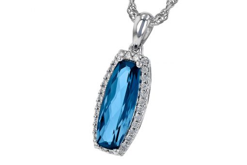 Oblong Cushion cut pendant with elongated cushion cut London Blue Topaz surrounded by round accenting diamonds, diamonds totaling .12ct, G Color, SI1/2 clarity, 14k white gold 18 inch chain