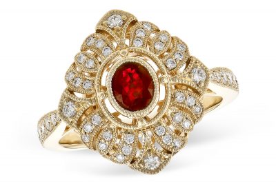 Vintage style ring with .42ct oval ruby set in the center of diamond sahpe lined with milgrain and diamonds, all diamodns total .38ct, G Color SI1/SI2 clarity, 14k yellow gold